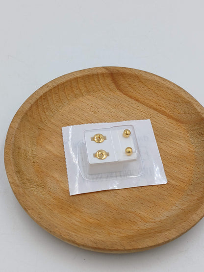 Gold stud earrings