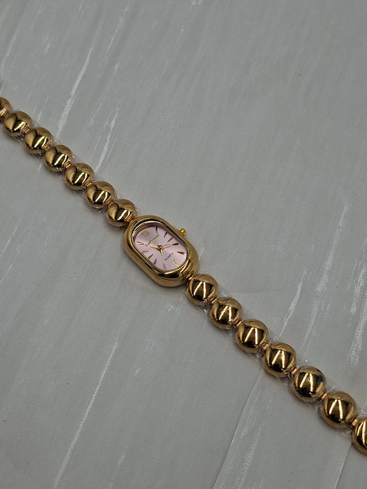 Oval Gold and Pink Wristwatch