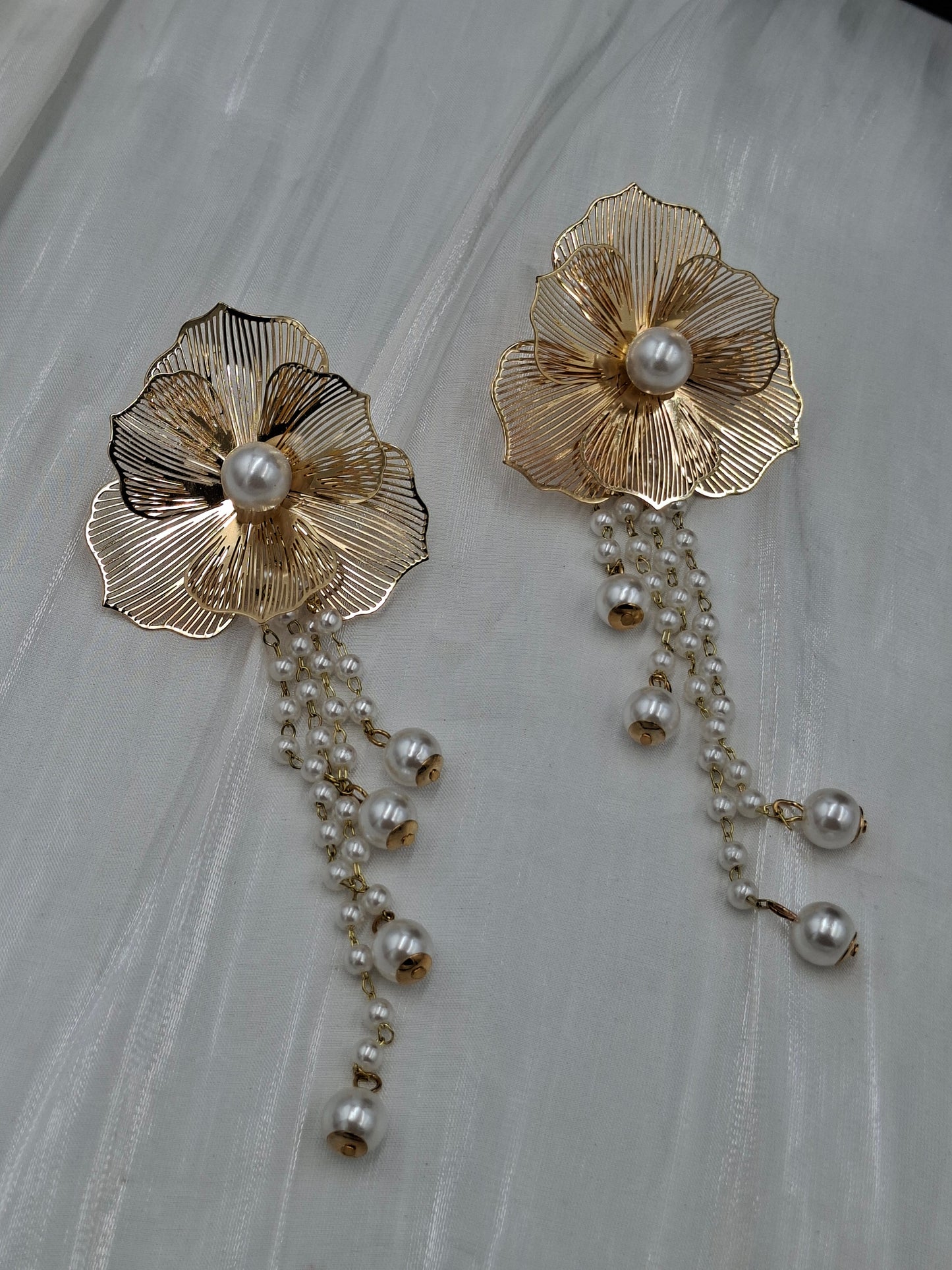 Gold Dangling Pearl Earrings